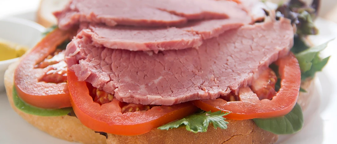 An image of corned beef sandwich on a plate
