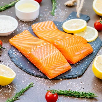 An image of raw salmon meat on a cutting board