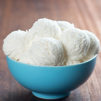 A vanilla ice cream in a light blue bowl