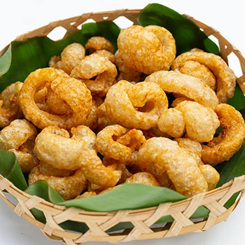 Pork rinds on a wooden basket and leaves