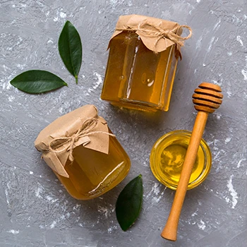 A top view image of three honey jars