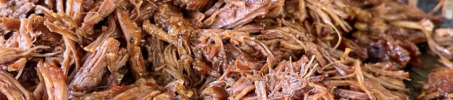 A close up image of shredded birria meat