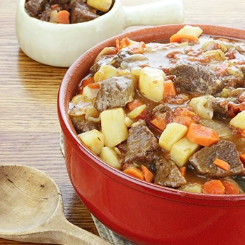 An image of beef pot roast on a pot and a bowl