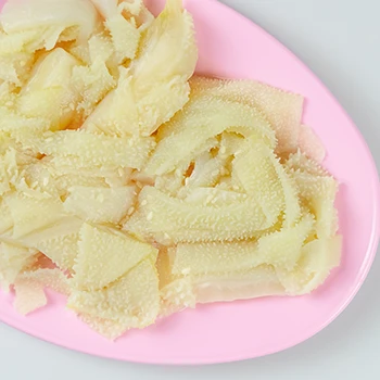 Top view image of tripe meat on a pink plate