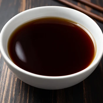 A close up image of Worcestershire sauce on a bowl