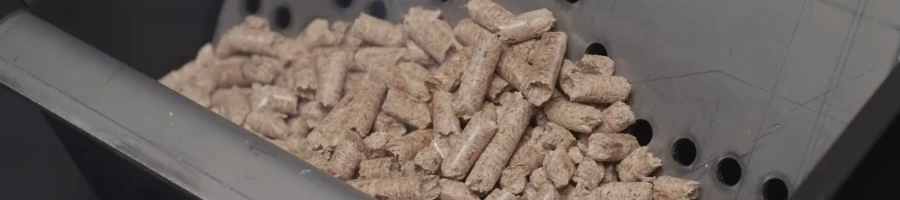 A close up image of wood pellets in a smoker