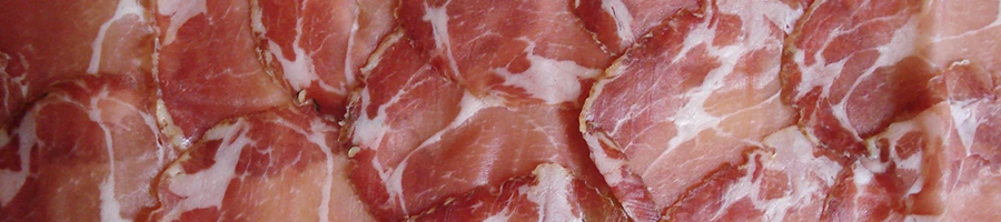 A close up image of capicola meat slices