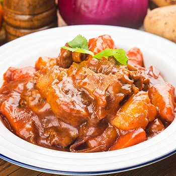 An image of oxtail stew dish on a white plate