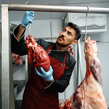 An image of a butcher hanging a kosher meat