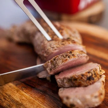 Slicing a cooked pork loin