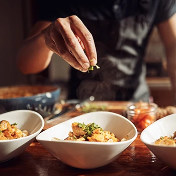 An image of a man preparing food at home