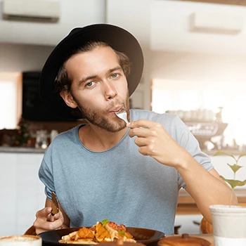 An image of a person wearing a hat who's craving red meat