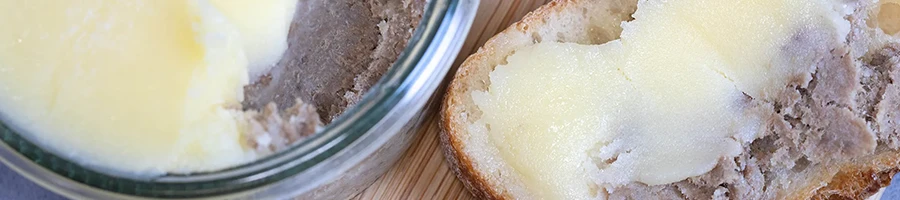 A top view image of potted meat in a jar and bread