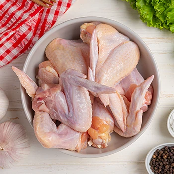 A top view image of poultry meat in a bowl, a chicken on a low-calorie diet