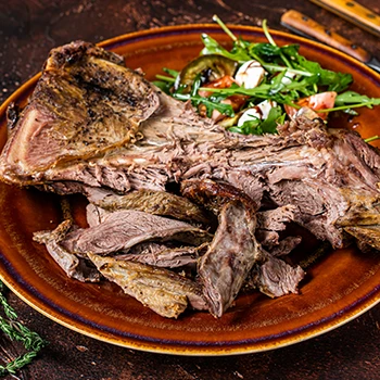 An image of cooked goat meat dish on a plate