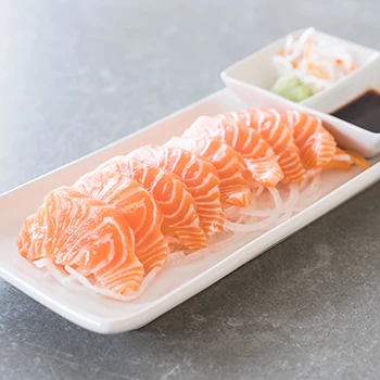An image of sashimi on a white plate