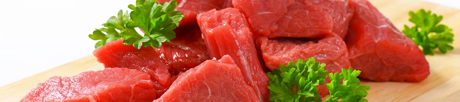 An image of diced beef on a cutting board