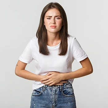 A woman experiencing stomach pain