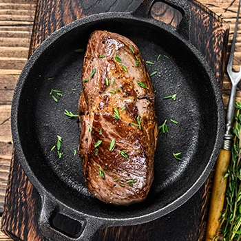 A top view image of cooked veal meat on a pan