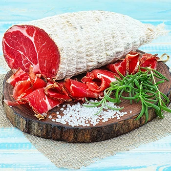 A close up image of capicola meat on a cutting board