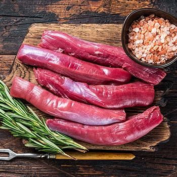 A top view image of raw kosher meat on a cutting board