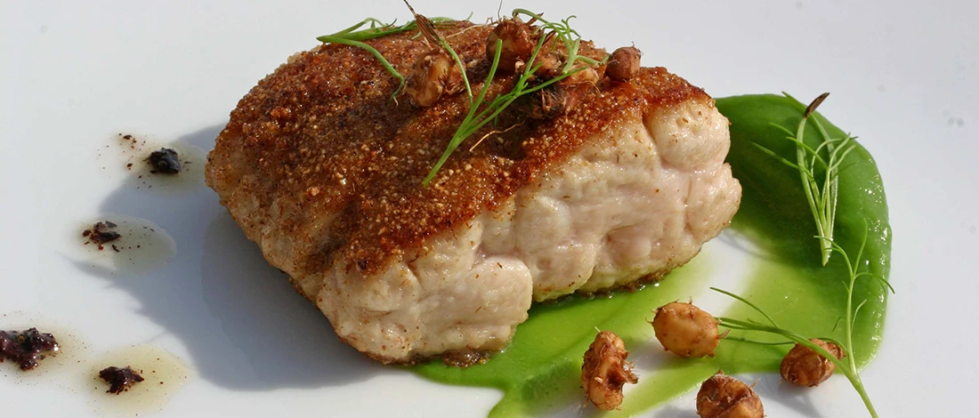 An image of sweetbread dish on a white plate
