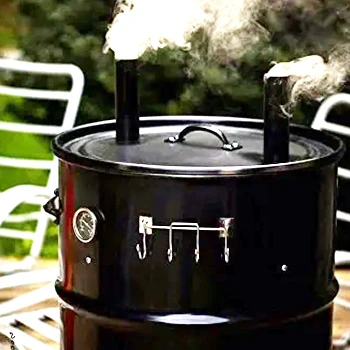 A close up image of smoking drum smoker