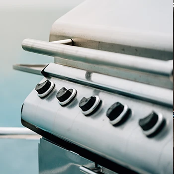 A close up image of a grill made of stainless steel