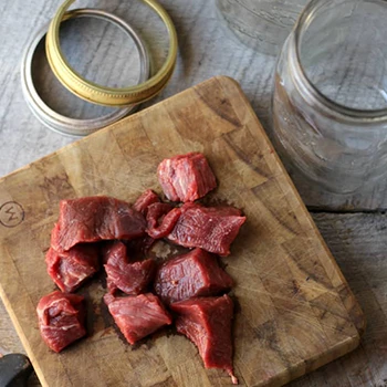 A top view image of beef meat ready for canning