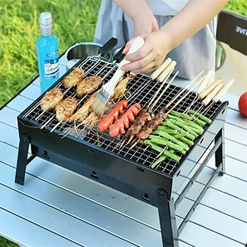An image of a person cooking on a grill outdoors