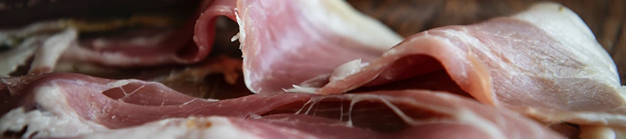 A close up image of deli meat on a table