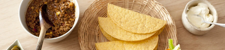 A top view image of taco ingredients on a table