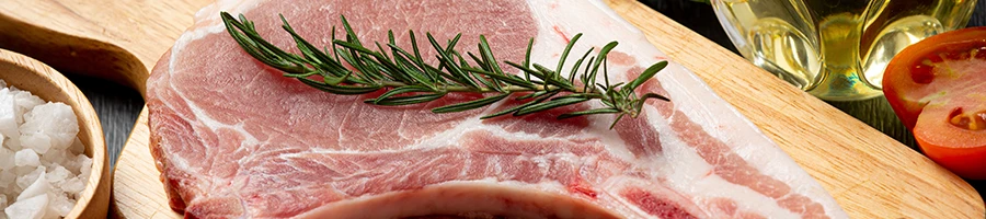 A close up image of healthy pork meat with herbs and spices