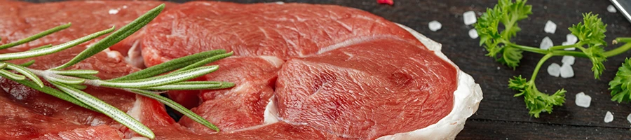 A close up image of raw meat and salt