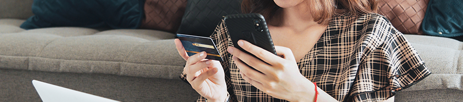 An image of a woman browsing online for the best charcoal grills under $500