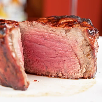 A perfect medium rare filet mignon sliced in the middle