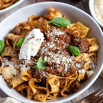 Cheek meat ragu dish on a white bowl