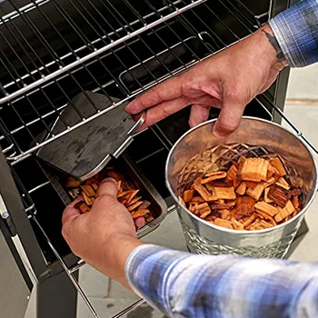 An image of a person using a smoker for turkey