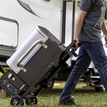 A man pulling a camping grill that is convenient to use