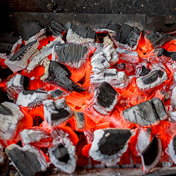 An image of burning charcoal as a fuel type for charcoal grills