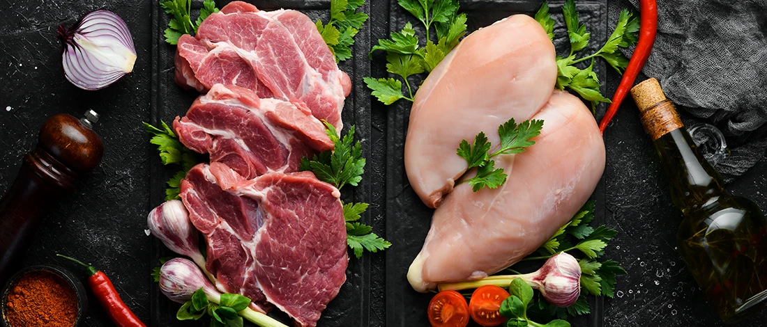 A side to side image of raw beef and chicken meat