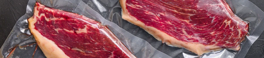 A close up image of vacuum sealed raw meats