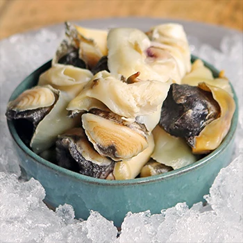 An image of a bowl full of conch meat on top of crushed ice