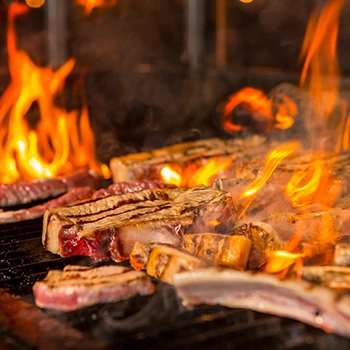 Grilling steak on a high heat grill