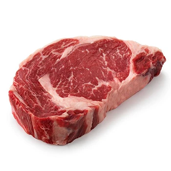 A rib eye steak on a white background