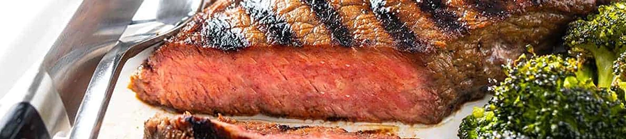 A close up shot of delicious top round steak on a plate