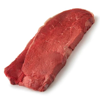 A raw top round steak on a white background