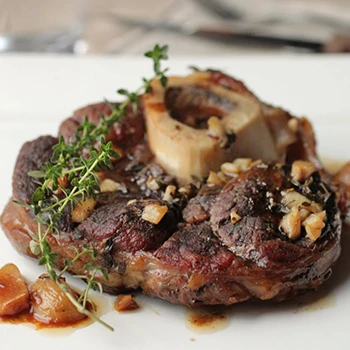 A tender and savory beef shanks on a white plate