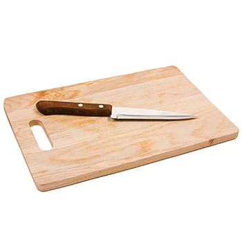A clean knife and cutting board on a white background