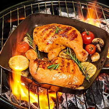 Chicken meat being cooked in high heat